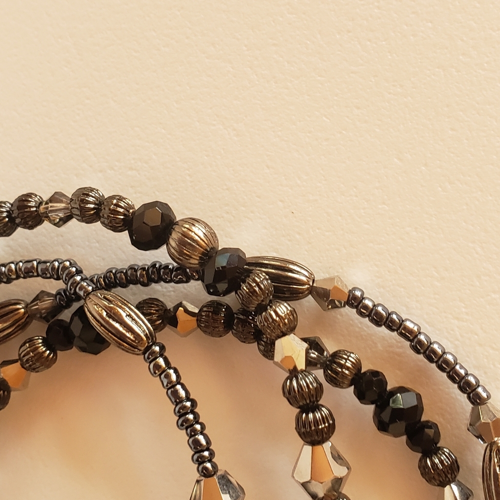 Set of 4 black, silver and gray bracelets